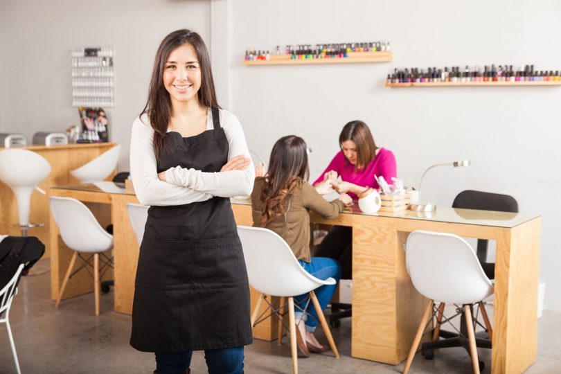 Salon owner standing in her nail salon