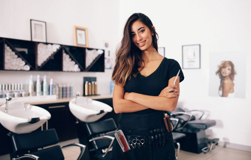 Hair salon owner standing in a hair salon