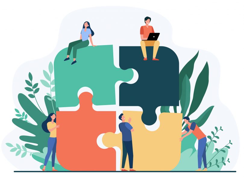 Illustration of team members working together as part of a jigsaw puzzle